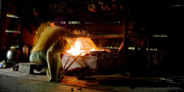Keeping watch. cooking sagu over the flames